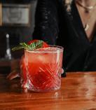 Bartender serving a non-alcoholic cocktail made with Drømme Awake